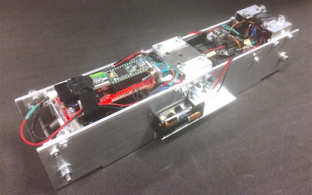 Falling with Style: Sticking the Landing by Controlling Spin during Ballistic Flight